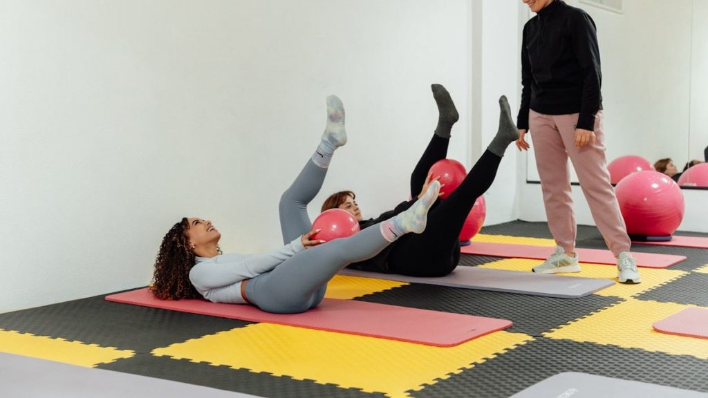 a group of people doing exercises in a gym
