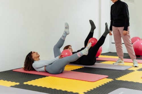 a group of people doing exercises in a gym